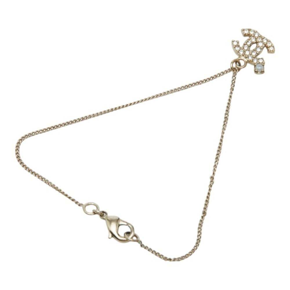 CHANEL Gold Pearl Logo Charm Bracelet - Picture 2 of 7